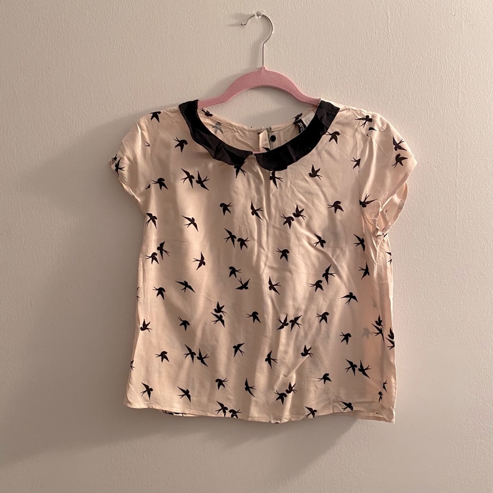 Collared birdie blouse.